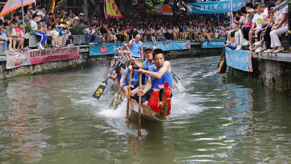 Dragon boat drifting race at Diejiao canal during Dragon Boat Festival in Guangzhou