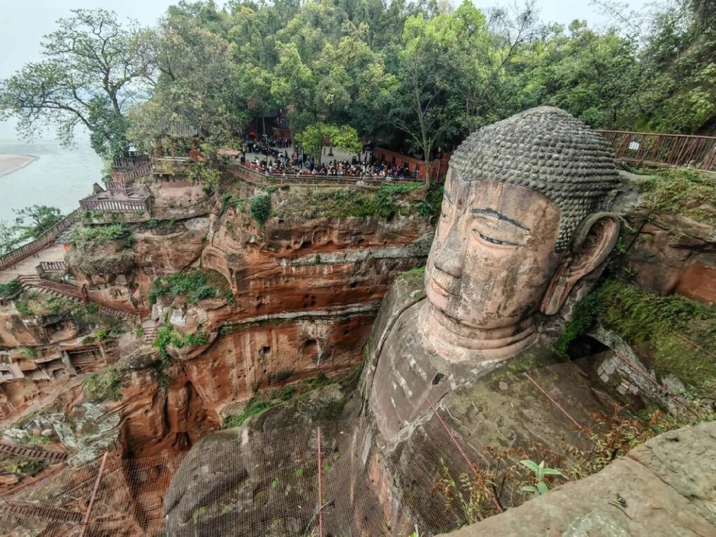Leshan Giant Buddha carved into the cliffside, seen from the Nine-Turn Plank Walk on the 2-day tour from Chengdu